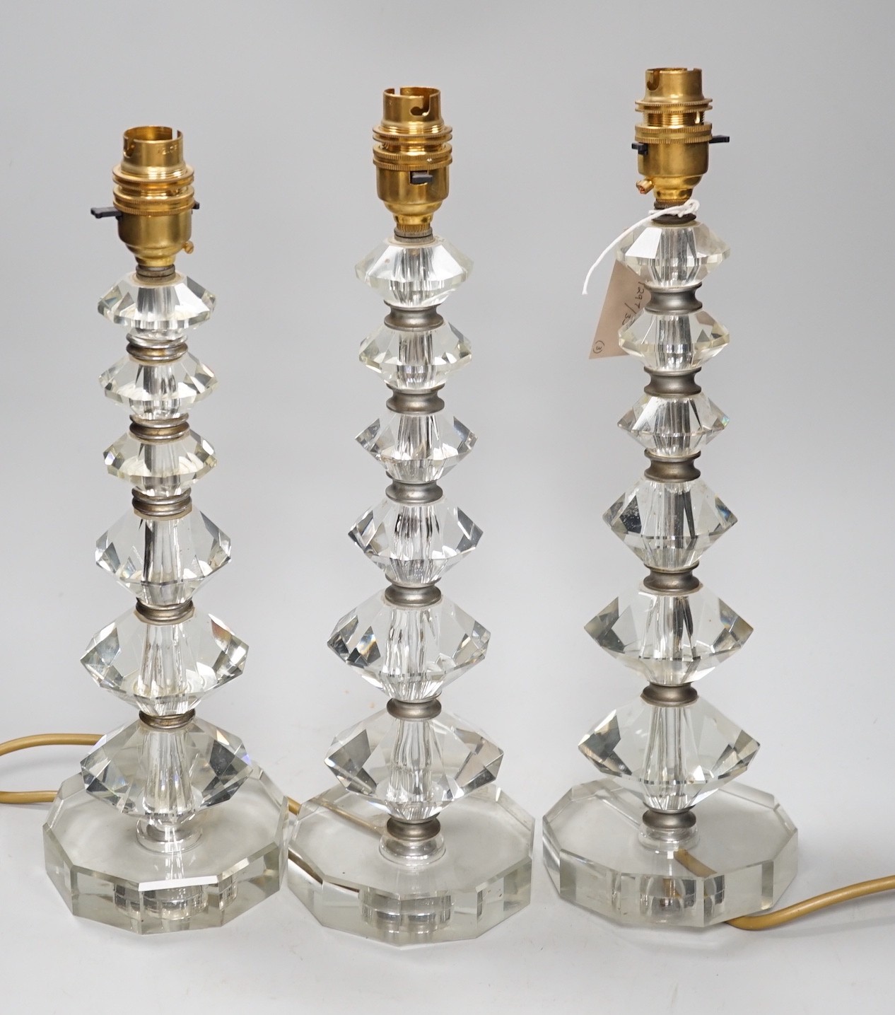 A set of three Art Deco cut glass table lamps 37cm total height